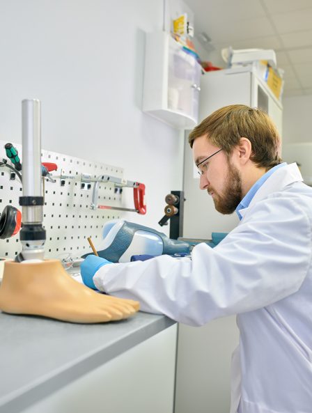 young-prosthetist-working-laboratory